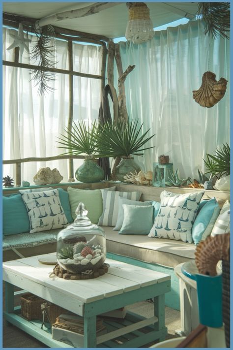 Cozy beach-themed living area with seashell decor and turquoise accents. Beach Glam Decor, Beach Living Room Ideas, Beach Themed Living Room, Cozy Coastal Living Room, Summer Living Room Decor, Ensuite Bathroom Designs, Modern Bedroom Colors, Themed Living Room, Tropical Living Room