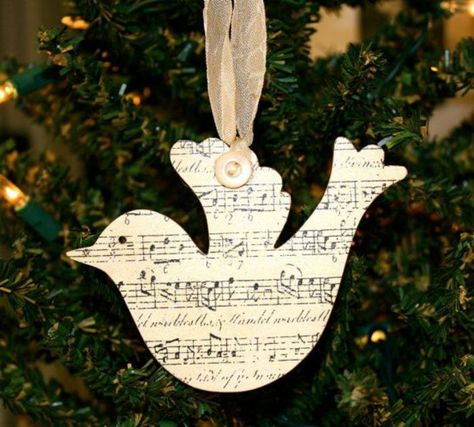 10 Beautiful Sheet Music Christmas Ornaments You Can Make Yourself Sheet Music Ornaments, Shabby Chic Ornaments, Music Christmas Ornaments, Shabby Chic Christmas Ornaments, Cheap Christmas Trees, Dove Ornament, Sheet Music Crafts, Dove Ornaments, Diy Cupcake