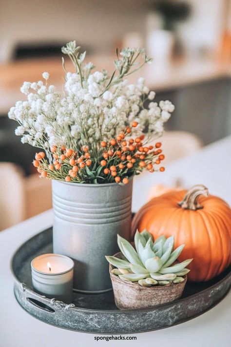 Thanksgiving is already creeping up, and I’m already planning how to make my dining room table look like the ultimate fall mood. I want it to evoke cozy, warm tones with the cutest fall centerpiece—mini pumpkins, candles, and some dried leaves for that perfect autumn aesthetic. The goal? To make my table super inviting but […] Fall Dining Table Centerpiece, Simple Fall Table Decor, Neutral Dining Room Decor, Fall Entry Table, Rustic Entry Table, Dining Table Decor Everyday, Dining Table Decor Centerpiece, Fall Dining Room Table Decor, Fall Dining Room Decor