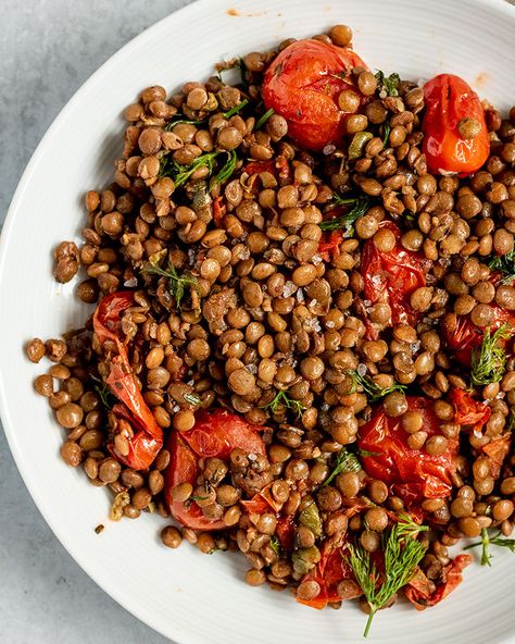 Lentils and tomatoes roasted with fresh minced garlic and olive oil and mixed with good quality balsamic vinegar and fresh herbs. This dish is delicious, easy to make, only uses 8 ingredients and can be made in less than an hour. Roasted Lentils, Tomato Lentils, French Lentils, Lentil Dishes, Sauteed Spinach, Green Lentils, Lentil Recipes, Side Salad, Roasted Sweet Potatoes