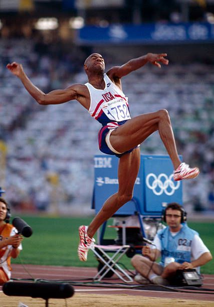 American track and field athlete Mike Powell pictured in action competing for the United States team to finish in second place to win the silver... Olympic Athletes Men, Iv Infusion, Track And Field Athlete, Pro Athletes, Long Jump, Olympic Athletes, Men's Fitness, Athletic Training, Basketball Pictures