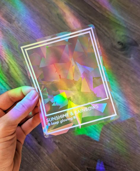 Step into a world of enchantment with our Prismatic Rainbow Making Suncatcher Stickers! 🌈✨ These delightful window decals are a really cool way to infuse your space with vibrant rainbow beams! 😍🌈  Crafted with meticulous attention to detail, our rainbow makers feature our original designs printed in white on a prismatic sticker that refracts light, creating a mesmerizing kaleidoscope effect. Spread joy by surprising friends & loved ones with these! As a birthday gift, housewarming gift, or ju White Rainbow Aesthetic, Suncatcher Vinyl, Suncatcher Stickers, Rainbow Things, Suncatcher Sticker, Aesthetic Rainbow, Dopamine Decor, Indoor Window, Brand Ideas