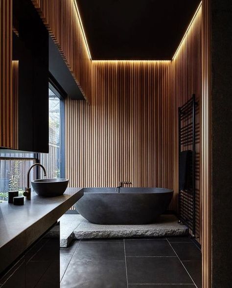 a moody zen bathroom done with wooden slabs and stone in dark shades, with built in lights Futuristic Bathroom, Bathroom Lighting Design, Modern Tub, Dark Bathrooms, Zen Bathroom, Wooden Bathroom, Trendy Bathroom, Black Floor, Wood Bathroom