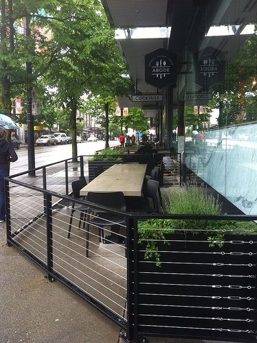 ABODE Restaurant 1223 Robson St - cable railings and concrete tabletops #hoteldesign Restaurant Design Rustic, Outdoor Restaurant Patio, Coffee House Design, Patio Railing, Retail Facade, Outdoor Restaurant Design, Restaurant Patio, Railings Outdoor, Restaurant Seating