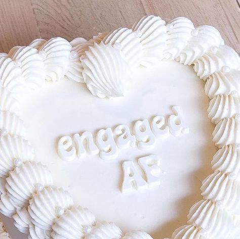 CRUMB on Instagram: "Engaged AF 🤍  #engaged #engagement #proposal #proposalideas #cake #cakedecorating #cakesofinstagram #cakeshop #vintage #vintagestyle #heart #heartcake #coquette #bride #bridetobe #wedding #weddingcake #weddingcakes #bridal #bridetribe #shesaidyes #engagement #centralcoast #santabarbara #sanluis #slocal #nipomo #bakery #local #baker #dessert" Engaged Af Cake, Engaged Af, Heart Cakes, Heart Shaped Cakes, Engagement Proposal, Heart Cake, Bride Tribe, Cake Shop, Vintage Heart