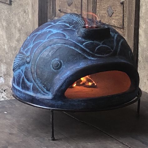 Our handmade, wood-fired pizza oven pre-heating on a table. Ceramic Pizza Oven, Outside Pizza Oven Diy, Metal Pizza Oven Outdoor, Diy Outdoor Fireplace With Pizza Oven, Diy Pizza Oven Outdoor, Pizza Oven Garden, Terracotta Pizza Oven, Woodfire Pizza Oven, Wood Pizza Oven