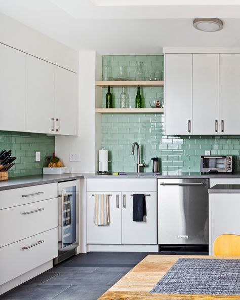 For a couple that loves to cook, finding an apartment with a spacious kitchen was on their wishlist ⭐ After being outbid on an apartment in Clinton Hill, the couple chose to buy a fixer upper unit and renovated the kitchen to fit their needs. Dark Teal Backsplash Kitchen, Kitchen Teal Backsplash, Funky Kitchen Tiles, Teal Kitchen Backsplash, Teal Backsplash Kitchen, Beautiful Kitchen Tiles, Contemporary Kitchen Tiles, Ceramic Kitchen Tiles, Tile Renovation