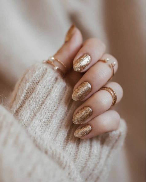 Wave goodbye to 2020 and ring in 2021 with these pretty New Year's nail ideas that have plenty of glitz and glam. #naildesigns #nails #newyearsevenails #newyearsideas Gold Gel Nails, New Years Nail Designs, New Years Eve Nails, Golden Nails, Gold Nail, Sparkle Nails, Winter Nail Designs, New Year's Nails, Beauty Nail