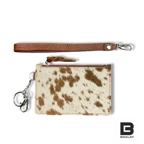 🤠 Make a statement with our cowhide keychain wallet leather wristlet in stunning saddle tan and white. Crafted from 100% genuine hairon hide leather, this unique cow print wallet is perfect for cowgirls on the go. With space for credit cards, coins, and cash, it’s ideal for rodeos and countryside adventures. 🐄 Real cow skin fur, real style! @baalayshop #CowhideKeychainWallet #SaddleTanLeather #GenuineHaironHide #CowPrintWallet #CreditCardHolder #CowgirlEssentials #WesternStyle #RodeoReady... Cowhide Keychain, Western Pouch, Western Wristlet, Cow Print Wallet, Western Leather Wallets With Card Slots, Cow Skin, Keychain Wallet, Cow Hide, Real Style