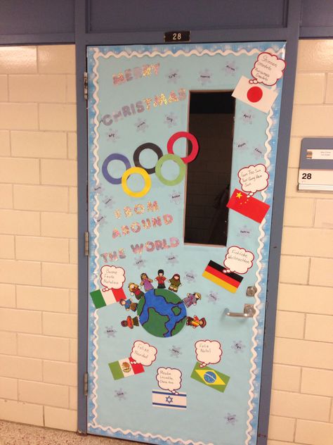 Olympic themed Christmas door. Merry Christmas from around the world. Holiday Around The World Door Decoration, Holidays Around The World Door Decorating Contest, Christmas Around The World Classroom Door, Around The World Classroom Door, Christmas Around The World Door Decor, Nursery Teaching Ideas, Christmas Around The World Italy, Christmas Library Display, Doorway Ideas