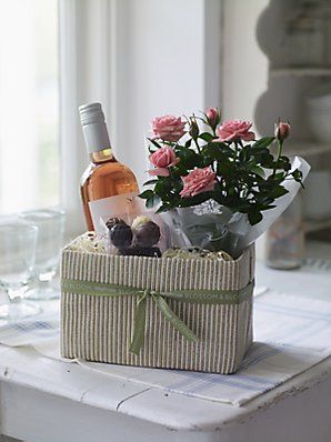 Gift Basket With Plant, Wine With Flowers Gift, Wine And Flowers Gift Basket, Gift Basket Wrapping, Gardening Hamper Gift Ideas, Flower Bouquet And Wine Bottle Gift, Housewarming Basket, Candy Flowers, Wine Gift Baskets