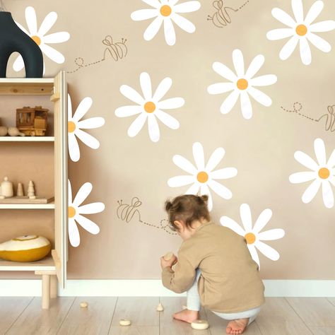 Looking to create a cozy nursery for your little one? Check out these stylish baby room decor ideas that will transform any space into a dreamy haven. From adorable wall art to cute crib accessories, these tips will help you design the perfect baby room. Wall Art For Baby Room, Simple Wall Art Painting Bedrooms, Painting Flowers On Wall, Girls Flower Bedroom, Simple Wall Murals, Wall Painting Ideas Bedroom, Daisy Decals, Babies Bedroom, Wall Painting Flowers