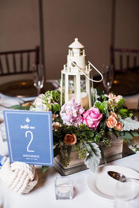 30 Nautical Wedding Ideas ❤️ nautical wedding centerpiece in wooden crate lighthouse with bright flowers leigh skaggs photography #weddingforward #wedding #bride #weddingdecor #nauticalwedding Nautical Wedding Centerpieces, Nautical Wedding Reception, Nautical Centerpiece, Wedding Aisles, Lighthouse Wedding, Lantern Centerpiece Wedding, Beach Wedding Decorations Reception, Beach Wedding Centerpieces, Nautical Wedding Theme