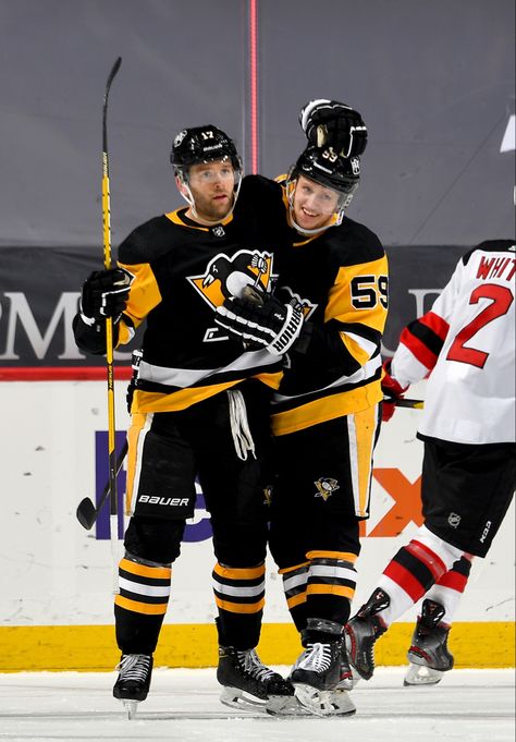 Bryan Rust celebrates his goal against the New Jersey Devils with teammate Jake Guentzel. The Pittsburgh Penguins went on to defeat the Devils by a score of 4-2. Jake Guentzel, Nhl Pittsburgh Penguins, The Devils, Pittsburgh Penguins Hockey, Penguins Hockey, New Jersey Devils, Pittsburgh Penguins, Pittsburgh, Nhl