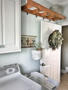 Laundry Room Makeover: 5 Easy Steps | Bless This Nest Ladder Laundry Rack, Laundry Room Ladder Drying Rack, Laundry Ladder Drying Rack, Laundry Room Wreath Ideas, Laundry Drying Rack Ideas, Laundry Basement, Basement Laundry Room Makeover, Basement Diy, Farmhouse Laundry Room Ideas