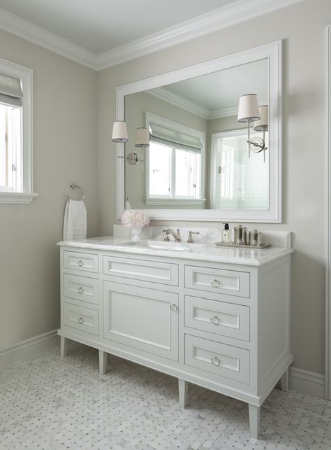 Traditional bathroom boasts light gray walls framing a extra wide single vanity on legs adorned ... Light Grey Walls, Condo Decorating, Subway Tiles, Luxe Interiors, Dream Bathrooms, Bathroom Renos, Single Sink, Traditional Bathroom, Bath Remodel