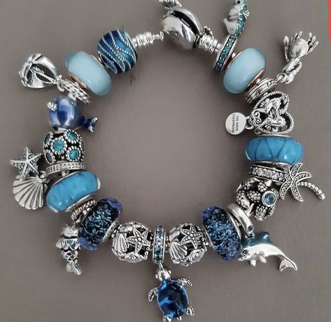 Blue Pandora Bracelet Ideas, Pandora Bracelet Aesthetic Blue, Blue Pandora Bracelet, Blue Charm Bracelets For The Beach, Pandora Bracelet Light Blue, Pandora Azul, Blue Pandora Charms, Pandora Bracelet Blue Theme, Colourful Pandora Bracelet