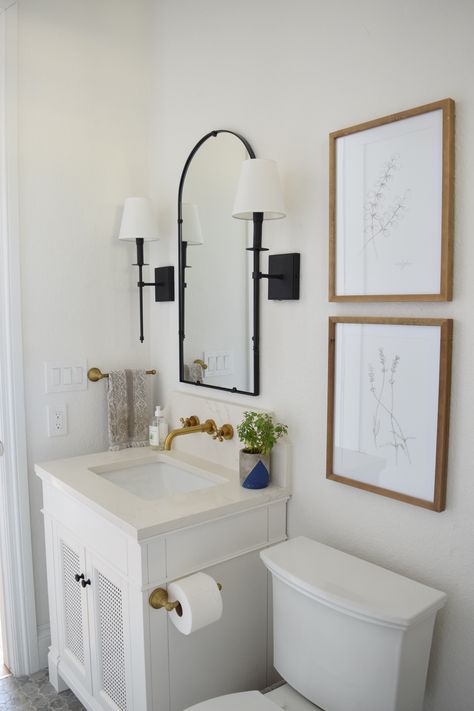 Modern traditional small bathroom with Sherwin Williams "Snowbound" walls, white vanity and brass wall mount faucet. Sherwin Williams Snowbound Walls, Snowbound Walls, White Half Bathroom, Brass Wall Mount Faucet, Bathroom Wall Faucets, Powder Bathroom Ideas, Sherwin Williams Snowbound, Small White Bathrooms, Small Half Bath