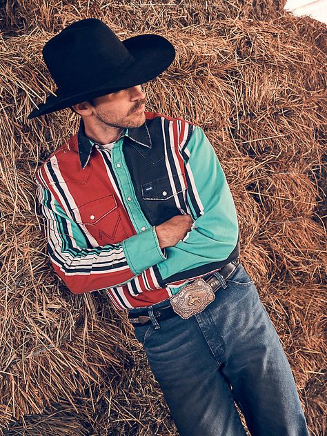 Classic style with a modern edge. Our Vintage-Inspired Brushpopper Western Snap Work Shirt will take any outfit up a notch. It’s crafted from cotton for comfort in any season, and it comes with a 90’s-inspired design full of bold, colorful stripes. The placement of the stripes as well as the vintage fading on the shirt is unique so no two shirts are alike. It comes with all the iconic details you know and want, including the pointed yokes from front to back, the chest pockets with our signature “W” stitching, and pearl snaps. Plus, its regular fit isn’t too tight or too loose. Short Uggs, Wrangler Vintage, Western Boots For Men, Western Store, Wrangler Shirts, Work Boots Men, Cowgirl Western, Jumpsuit Jacket, Work Shirt