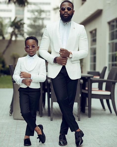 This father and son duo wore matching embroidered white tuxedos paired with elegant black trousers and shoes. To finish their look they added round glasses for a dapper outfit at a glamorous wedding. Click to find more stylish white tuxedos for every wedding style. // Photo: King Levi Dapper Black Fathers, Fashion Suits For Men, African Men Fashion, Men’s Suits, African Men, Formal Business, Mens Fashion Suits, Black Men Fashion, Well Dressed Men