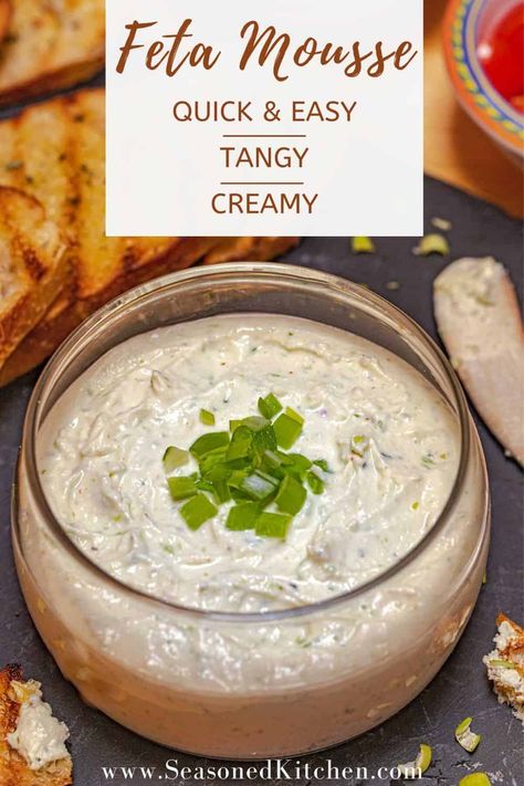 Feta Mousse is a tangy, creamy, super flavorful dish that's quick and easy to prepare. Just 4 basic ingredients (feta, sour cream, EVOO and green onion) are accented by garlic powder, oregano, cayenne pepper and salt. Serve with grilled bread for an easy and elegant appetizer. #fetarecipes #easyappetizers #fetamousse #seasonedkitchen #pantryingredients #makeaheadappetizers Feta Mousse, Make Ahead Appetizers, Elegant Appetizers, Feta Recipes, Grilled Bread, Quick And Easy Appetizers, Small Food Processor, Mousse Recipes, Green Onion