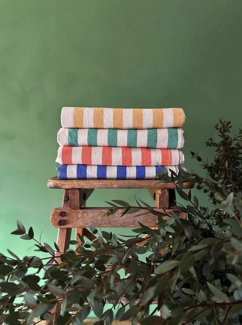 Welcome Bohemia 🌍   Sorrento Hammam Towels in mustard, olive, orange, indigo; a classic stripe cotton towel reminiscent of childhood beach holidays and jaunty sunshades. Produced by a family of weavers in Turkey using locally harvested cotton.  Collaborating with artisans from Morocco to Turkey, Bohemia brings timeless, functional objects with a contemporary twist. Celebrate authentic craftsmanship and sustainable production. 🌺⁠  Follow the link to shop the collection!