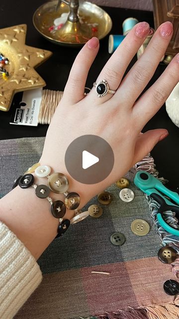 Ɠɾօէէօ🪡 on Instagram: "How to make a Button Bracelet ✨🪡 like friendship bracelets for crafters! #buttons #diyjewelry #jewlerymaking #sewing #crafts #vintageaesthetic #coraline" Button Necklace Tutorial, Button Necklace How To Make A, Button Bracelet Diy Simple, Button Bracelet Tutorial, Button Jewelry Diy How To Make, Bracelets With Buttons, Button Diy Ideas, How To Make Button Bracelets, How To Make A Button Bracelet