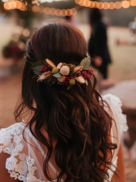 This wavy half-updo is enhanced with rustic floral accents, creating a charming fall haircut that’s perfect for outdoor gatherings. The cascading waves and earthy flowers give the hairstyle a natural, effortless appeal, ideal for those who want a touch of nature in their look. Whether for a fall wedding or a casual event, this hairstyle is sure to impress. Wedding Hairstyles Fall, Fall Wedding Hairstyles For Bride, Earthy Hairstyles, Earthy Flowers, Fall Wedding Hair, Fall Haircut, Outdoor Bride, Winter Wedding Hair, Fall Wedding Hairstyles