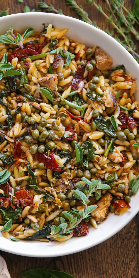 Spinach Orzo with Sun-Dried Tomatoes, Artichokes, and Capers - in a white bowl. Orzo With Capers, Mediterranean Diet Artichoke Recipes, Winter Orzo Salad Recipes, Healthy Vegetarian Salads, Leftover Orzo Recipes, Recipes For Dinner Healthy Vegetarian, Orzo Recipes Dairy Free, Veg Side Dish, Spinach Mushroom Orzo