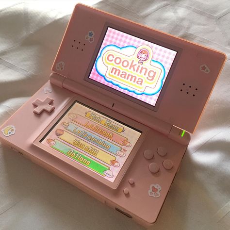 Coral Pink Nintendo Ds Lite open on white background. Decorated with various heart and star stickers. Cooking Mama is displayed on  the screen. Pink Ds Aesthetic, Nintendo Ds Aesthetic, Ds Aesthetic, Aesthetic Nintendo, Pink Nintendo, Pink Games, Switch Accessories, Nintendo 3ds Xl, Nintendo Switch Lite