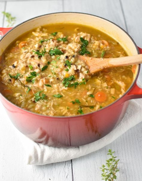 This chicken and brown rice soup is very easy to make and combines fresh herbs with rotisserie chicken for a comforting flavor. Gluten and dairy free, it's the perfect cozy soup. #soup #chickensoup #glutenfree #souprecipes #chickenrecipe Brown Rice Chicken Soup, Chicken Brown Rice Soup, Chicken And Brown Rice Soup, Heart Healthy Soup, Brown Rice Soup, Vegetable Rice Soup, Dizzy Cook, Rotisserie Chicken Soup, Vegan Tortilla Soup