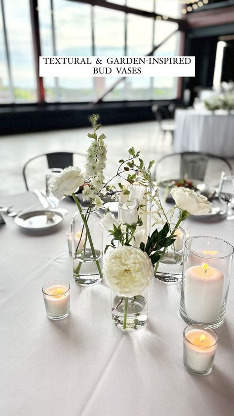 Graceful Blooms | Vibes and trends will change, but bud vases will always stay classy ✨ • Venue: @janserrstudio Catering: @sazshospitalitygroup... | Instagram Wedding Table Decor Bud Vases, Glass Bud Vases Centerpiece, Bud Vase And Floating Candle Centerpiece, Bud Base Center Piece Round Table, Wedding Centerpieces With Bud Vases, Bud Vase And Candle Centerpiece Wedding, Bud Vase And Candle Centerpiece, Bud Vase Centerpiece Round Table, Bud Vases Round Table Wedding