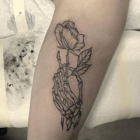 Beautifully fatal with this skeleton hand holding a rose from @scurvy_dan 🌹 Dan is booking March and April. Also keep your eyes peeled for… Skeleton Hand Holding Rose, Hand Holding Tattoo, Penny Tattoo, Lark Tattoo, Hand Holding Rose, Skeleton Hand Holding, Rose Tattoo Stencil, Small Wave Tattoo, Rose Tattoo Meaning