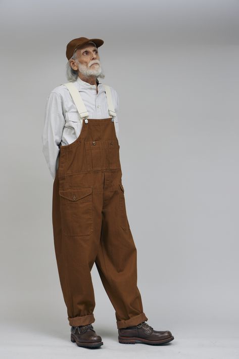 The Lybro Railway Dungaree is a refreshed classic Cabourn overall, inspired by the hardworking heritage railway workers. Designed with a relaxed fit and straight leg, these dungarees are crafted from a high quality cotton blend in a heavy 11.3oz woven drill, offering both durability and a timeless workwear aesthetic. Japanese Workwear Vintage, Workshop Outfit, Railway Workers, Wicked Fashion, Workwear Aesthetic, Japanese Workwear, Work Overalls, Heritage Railway, Nigel Cabourn