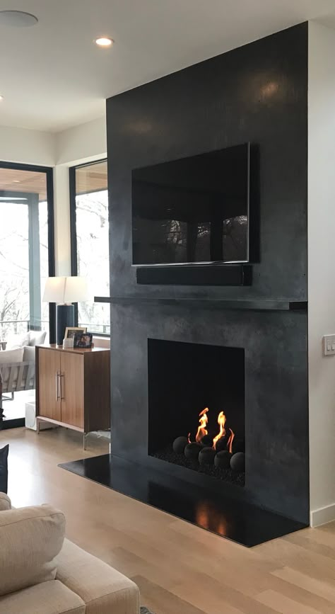 Black Wall And Fireplace, Black Drywall Fireplace, Fireplace Ideas Industrial, Black Faux Concrete Fireplace, Limewash Black Fireplace, Black Bedroom With Fireplace, Matte Black Fireplace Wall, Black Living Room With Fireplace, Black Painted Fireplace Wall