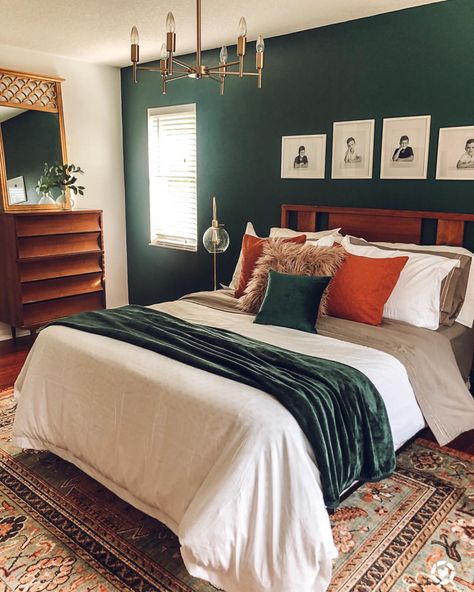 To my surprise, this post has gone viral on Pinterest. The color of the wall is Dark Everglade by @Behr . . . You do YOU, BOO! It may not… Jewel Tone Bedding Cozy, Dark Teal And Rust Orange Bedroom, Bedroom Ideas Eccentric, Emerald Green And Burnt Orange Bedroom Ideas, Jewel Green Bedroom, Pattern Bedding Ideas, Jewel Tone Master Bedrooms Decor, Dark Jewel Tone Bedroom, Dark Green And Orange Bedroom