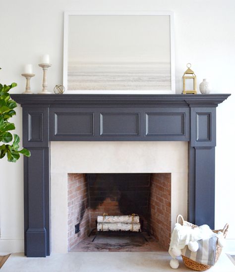 The fireplace paint color is Benjamin Moore Midnight Oil. Art is Patagonian Winter print from Minted.  #fireplaces Benjamin Moore Midnight Oil, Benjamin Moore Midnight, Coastal Castle, Painted Mantel, Painted Fireplace Mantels, Painted Fireplace, Grey Fireplace, Cottage Fireplace, Wood Burners