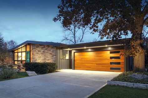 Midcentury Renovation in Wisconsin Delights Original Owners Mid Century Renovation, Waterfall Counter, Walnut Hardwood Flooring, Mcm Home, Wood Garage, Cedar Posts, Wood Garage Doors, Solar Panels Roof, Modernist Architects