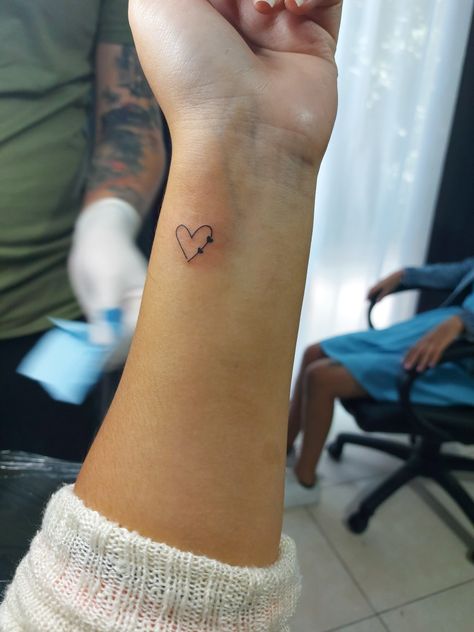 Small Wrist Tattoos Initials, Cross With 2 Hearts Tattoo, Love Mom Wrist Tattoo, Mother Wrist Tattoo, Tattoo Heart Initials, Mom Micro Tattoos, Minimalist Tattoo Mother, Tattoos For Your Kids Women, Tattoo Idea For Children