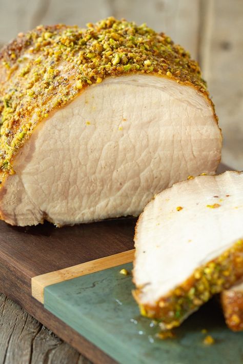 The pistachio crust on this boneless pork loin roast tops a honey soy glaze. Mustard and fennel seeds add a hint of spice. Pork Loin Dijon Mustard, Pistachio Pork Tenderloin, Lemon Pepper Pork Loin, Pistachio Crusted Pork Tenderloin, Pork Loin With Fennel And Apples, Boneless Pork Loin Roast, Dill Potatoes, Pork Loin Roast Recipes, Boneless Pork Loin