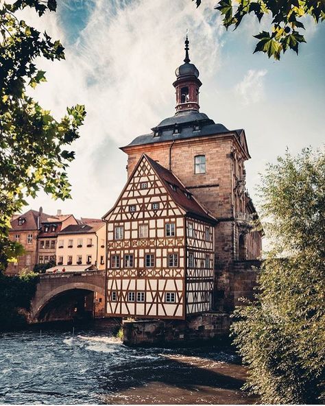 Old Town Hall, Bamberg, Germany 🇩🇪 The historic Old Town Hall of Bamberg, famously perched in the middle of the Regnitz River on a tiny island, showcasing the charming half-timbered architecture of this UNESCO World Heritage site in Bavaria, Germany. Old Germany, Bamberg Germany, Tiny Island, Bavaria Germany, Town Hall, Unesco World Heritage, Unesco World Heritage Site, Bavaria, Heritage Site