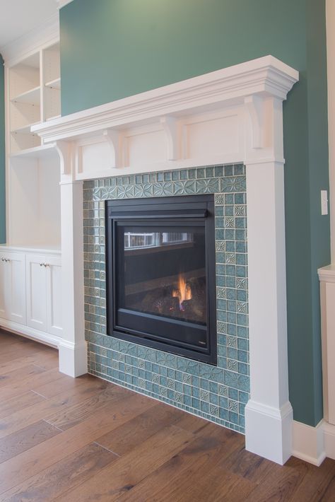 Fireplace: painted mantle, gas fireplace, custom mosaic tile surround, hardwood floors, painted custom built-ins Tile Around Fireplace Ideas Mid Century, Redesign Fireplace, Fireplace Surround Ideas Tile, Teal Fireplace, Colorful Fireplace, Fireplace With Tile Surround, Fireplace Mosaic, Fireplace Updates, Mantle Inspiration