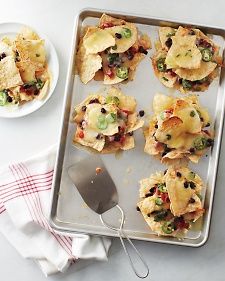 Individual Nachos--  Love this Superbowl party food idea.   Preheat oven to 350, stack 6 piles of tortilla chips on a rimmed baking sheet and layer cheese, beans, salsa, jalapenos, salsa, etc and bake until cheese is melted (about 6 minutes). Individual Nachos, Healthy Superbowl, Healthy Superbowl Snacks, Martha Stewart Recipes, Superbowl Snacks, Super Bowl Party, Game Day Snacks, Nachos Recipe, Super Bowl Food