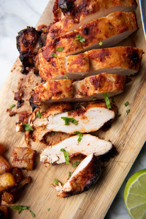 chicken, tortillas, cilantro on a board Chipotle El Pastor Chicken, Chicken Al Pastor Recipe Chipotle, Copycat Chipotle Chicken Al Pastor, Chipotle Chicken Al Pastor Recipe, Chicken Al Pastor Chipotle, Chicken Pastor, Chipotle Chicken Al Pastor, Chicken Al Pastor Recipe, Al Pastor Chicken