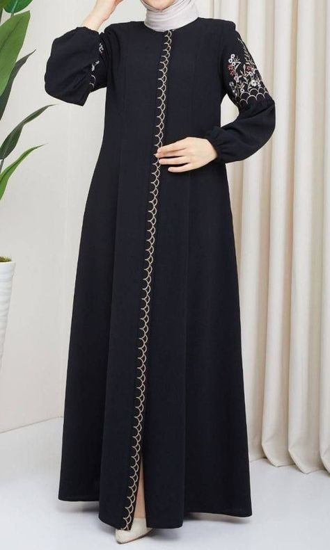 This beautiful Farasha style abaya has a plain inner maxi in fine jersey fabric with a chiffon embroidered loose outer layer and an embroidered matching belt for styling. Comes in standard size. Available in beige and black combination and black on black embroidery Black Abaya Embroidery Design, Aesthetic Abaya Designs, Abaya Embroidery Design, Abaya Fashion Black, Zipper Abaya, Black On Black Embroidery, New Abaya Designs, Burqa Designs, Beautiful Abayas