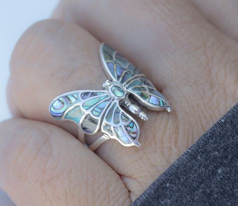 Experience the unparalleled quality of our 925 solid sterling silver butterfly ring, adorned with radiant abalone shells on the wings and body. Crafted from pure sterling silver, this ring guarantees lasting beauty and won't tarnish or change color, ensuring it remains as stunning as the day you received it. The abalone shell in this ring shines brilliantly, adding a touch of natural elegance and vibrant color. Each ring is meticulously handcrafted. This elegant abalone shell silver ring is perf Silver Butterflies, Silver 925 Rings, Silver Statement Rings, Butterfly Ring Gold, Butterfly Wedding Ring, Silver Ring Ideas, Butterfly Rings Jewelry, Cool Rings, Silver Ring