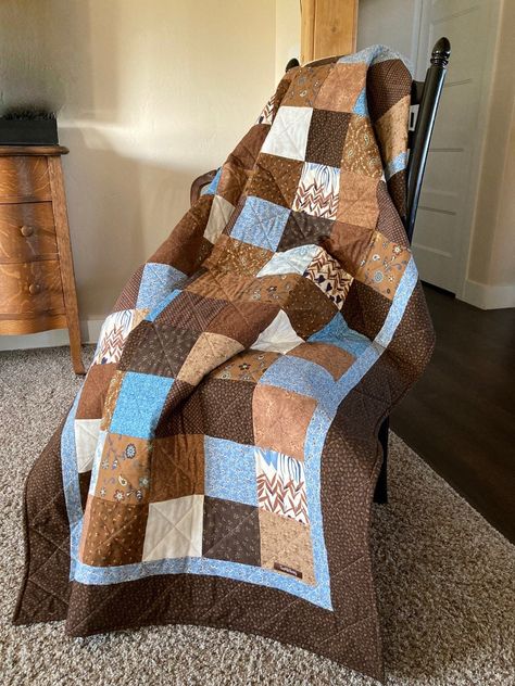 Country Living Decor and Lap Quilt! Lovely with Earthy Browns and Blue Accents. Generous Lap Size. Snuggles for Two. Couch Throw. Fall Decor. Earth Tones Decor. Finished Quilt Size: 50" x 63.5" Finished Block Size: 4.5" x 4.5" Batting: Cotton All Cotton Fabrics are used.  Colors include Shades of Brown; Chestnut to Chocolate; Cream White, and Medium Blue Shades. It is machine quilted and the binding is machine applied in double thickness for added durability. Ships USPS Priority Mail for free! I Brown Quilt, Country Living Decor, Earth Tone Decor, Rustic Quilts, Warm Browns, African Quilts, Two Color Quilts, Homestead Living, Country Quilts