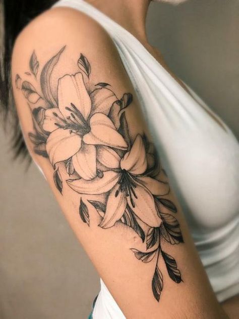 90 Awesome Lily Tattoo Designs with Meaning | Art and Design Lily Arm Tattoo For Women, Fineline Lily Tattoo, Black And White Lily Tattoo, Lily Floral Tattoo, Flower Piece Tattoo, Lily Forearm Tattoo, Floral Black Work Tattoo, Lilly Tattoo For Women, Upper Arm Floral Tattoo