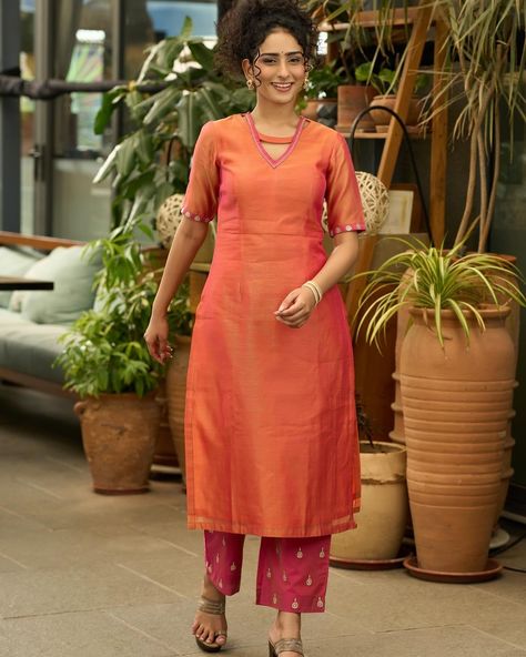 This stunning kurta set is crafted with graceful orange chanderi fabric and adorned with intricate gold embroidery. The optional dupatta adds an extra touch of elegance and versatility. Perfect for any occasion, it offers both style and comfort. Elevate your wardrobe with this timeless piece. #sujatra #sujatraglobal #festivecollection #newarrivals #cottonkurtasets #chanderikurta #goldembroidery #chanderipants #kurtapantset #occasionwear Chanderi Kurta Designs, Silk Kurti Designs, Churidar Designs, Silk Kurti, Simple Kurta Designs, Pakistani Fashion Casual, Kurta Neck Design, Kurta With Pants, Gold Embroidery