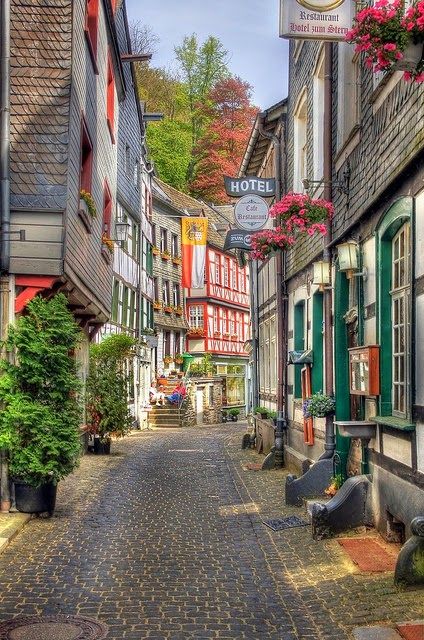 charming little village of monschau, eifel, germany including the brewery museum felsenkeller European Town, Narrow Street, Colorful Buildings, European Street, Hotel Logo, Voyage Europe, Beaux Villages, Strasbourg, Germany Travel